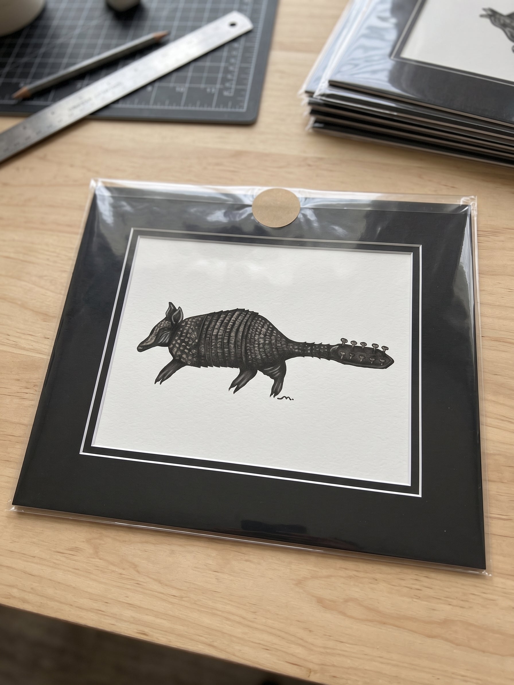 Stringadilllo signed Giclée print with black mat frame, edition of 100, by Maria Keller