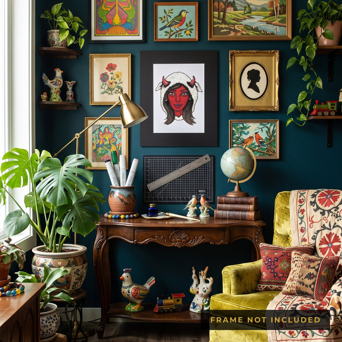 The Mama Shilli print framed on a gallery wall above a writing desk