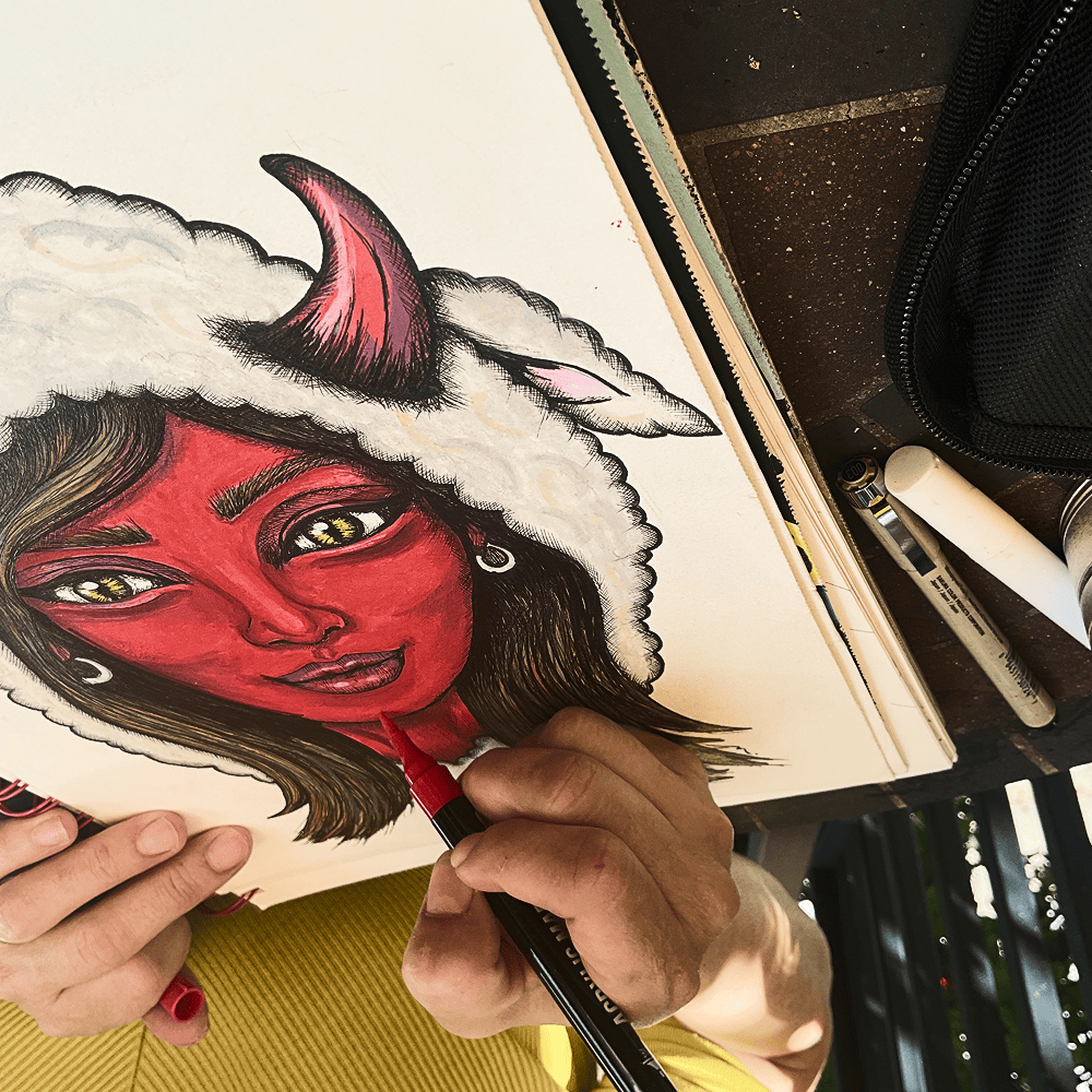 Red acrylic being laid into Mama Shilli's face with a brush marker